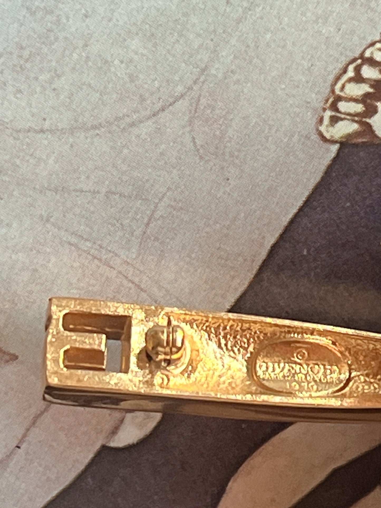 Givenchy 1979 logo brooch